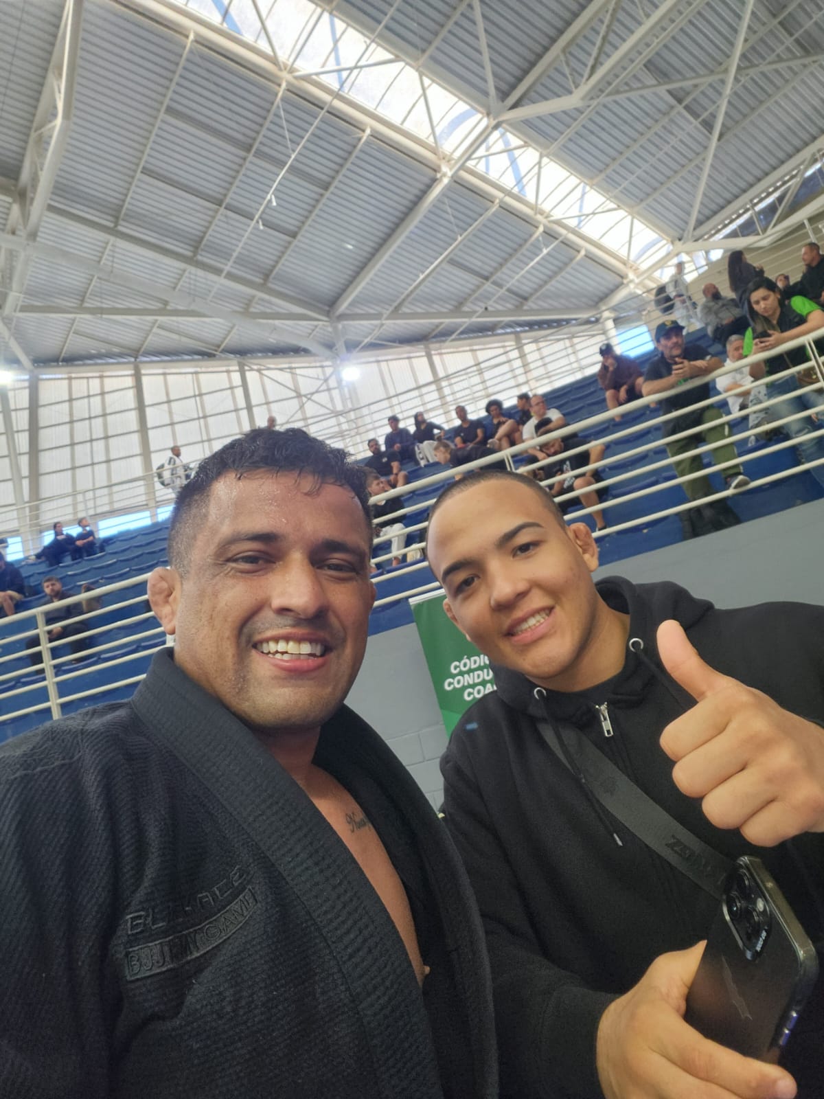 Professor e aluno em dia de competição
